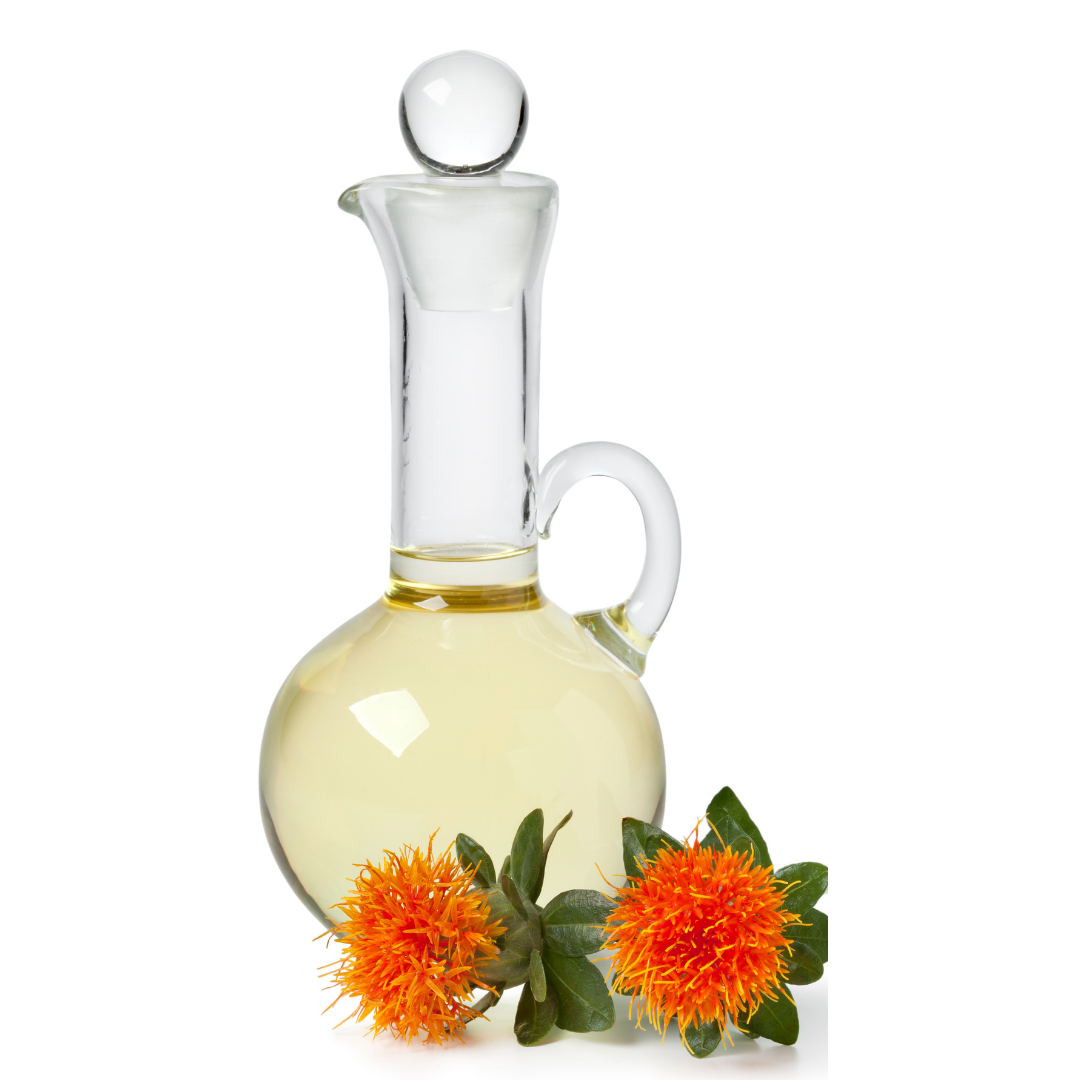 Elegant glass carafe filled with safflower oil surrounded by fresh safflower flowers at the base